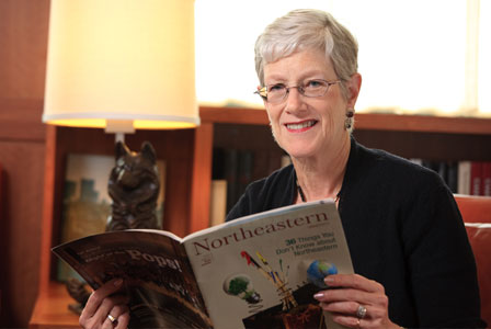 Janet Smith reading Northeastern magazine during a recent visit to the university.